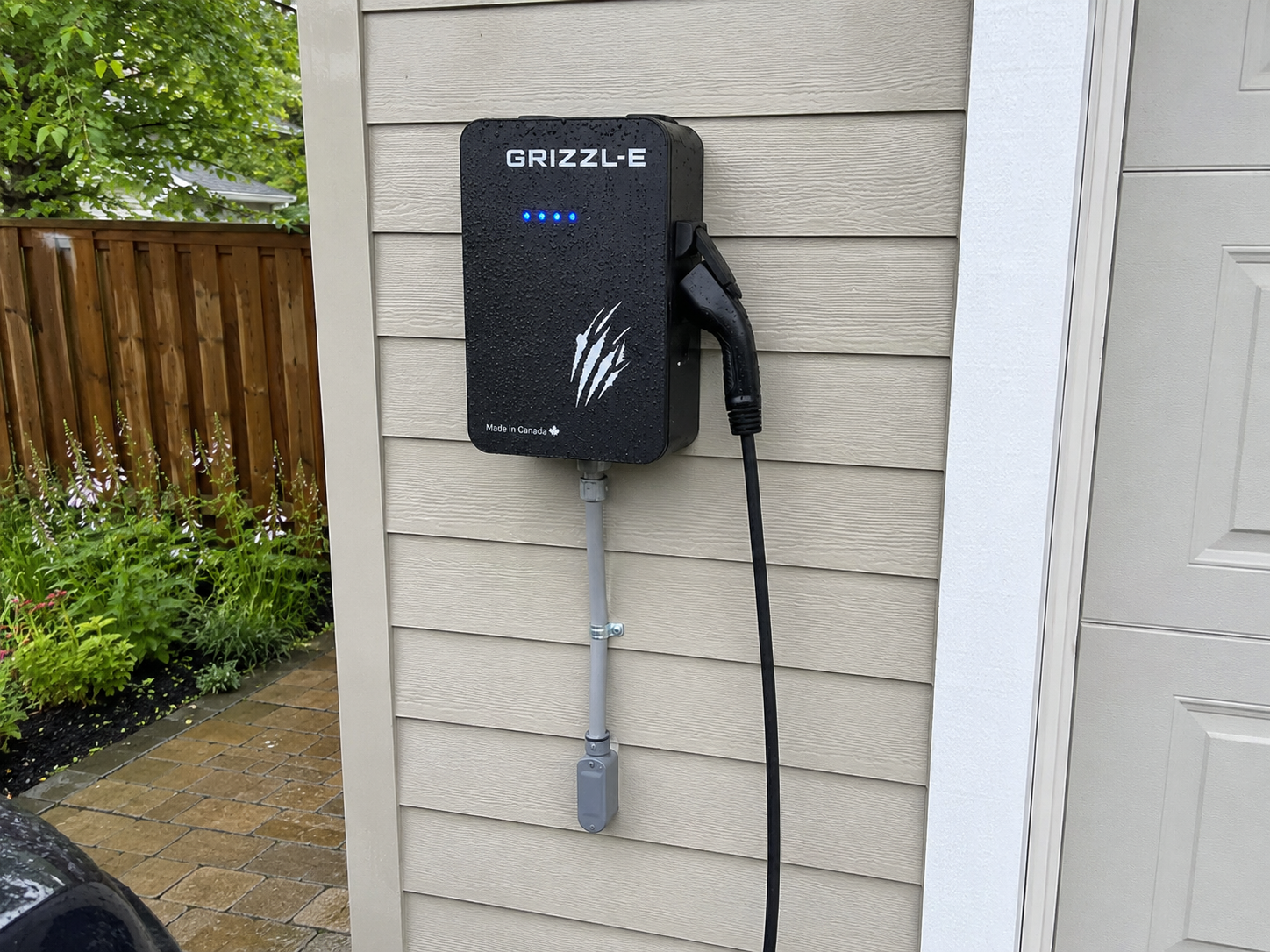 Weatherproof outdoor Grizzl-E EV charger installation on a historic downtown Clinton NJ home