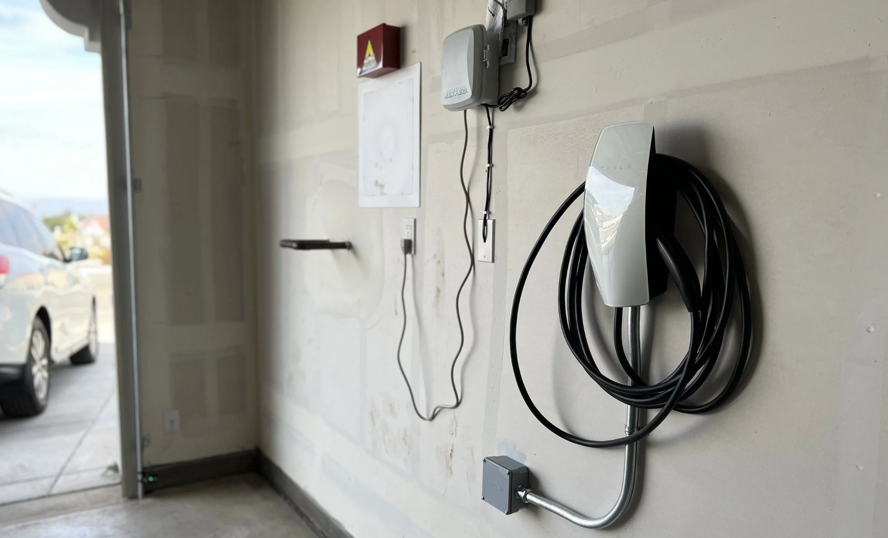 Tesla Wall Connector Level 2 EV charger installed in a garage in Flemington NJ on a dedicated 240V circuit